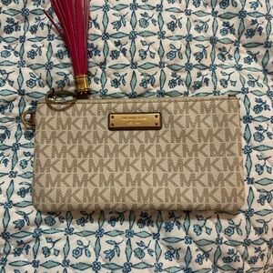 Michael Kors Tan Monogram Wristlet with Pink Tassel
